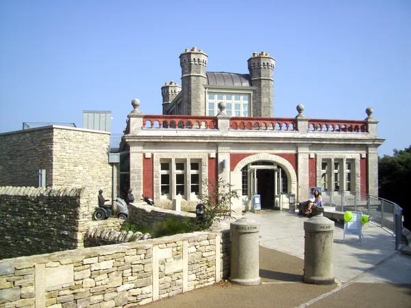 Victorian Durlston Castle in Durlston Country Park above the sea at Swanage