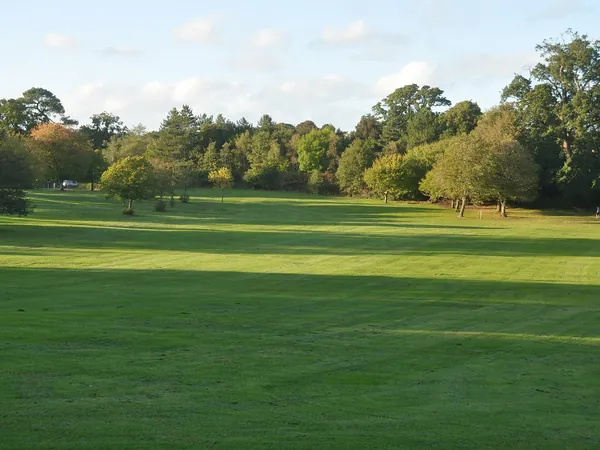 Lawns and trees in Upton Country Park, Upton, near Poole
