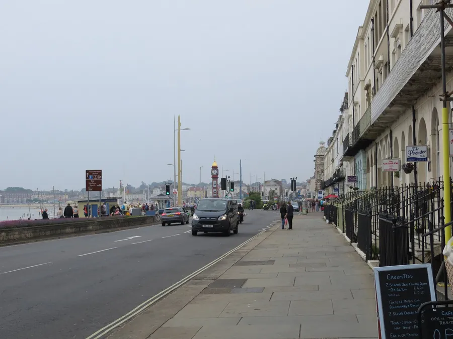 Georgian terraces along the Esplanade in Weymouth with the Jubilee Clock in the distance
