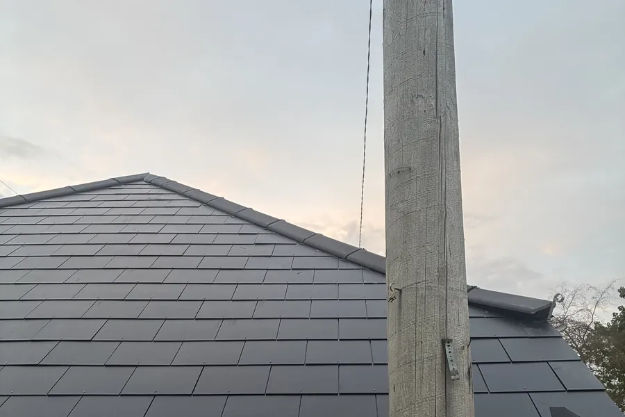 New slate roof on a small Dorset building, fixed to current standards to stand up to strong winds