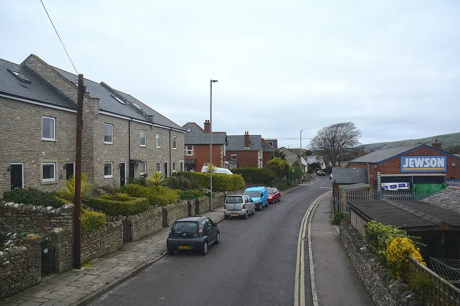 Purbeck stone terraced houses with slate roofs on a street in Swanage