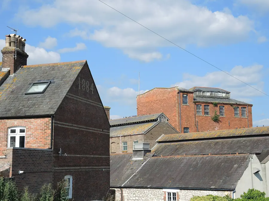 Slate roof with a rooflight next to the old brewery buildings in Weymouth
