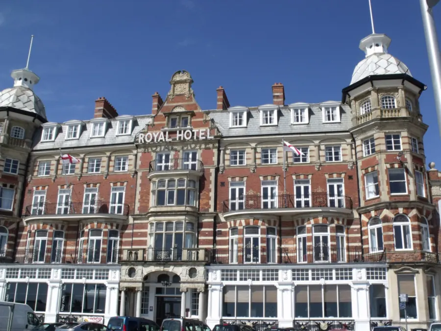 The Royal Hotel on Weymouth Esplanade, a listed Victorian building with slate roofs, dormers and corner turrets