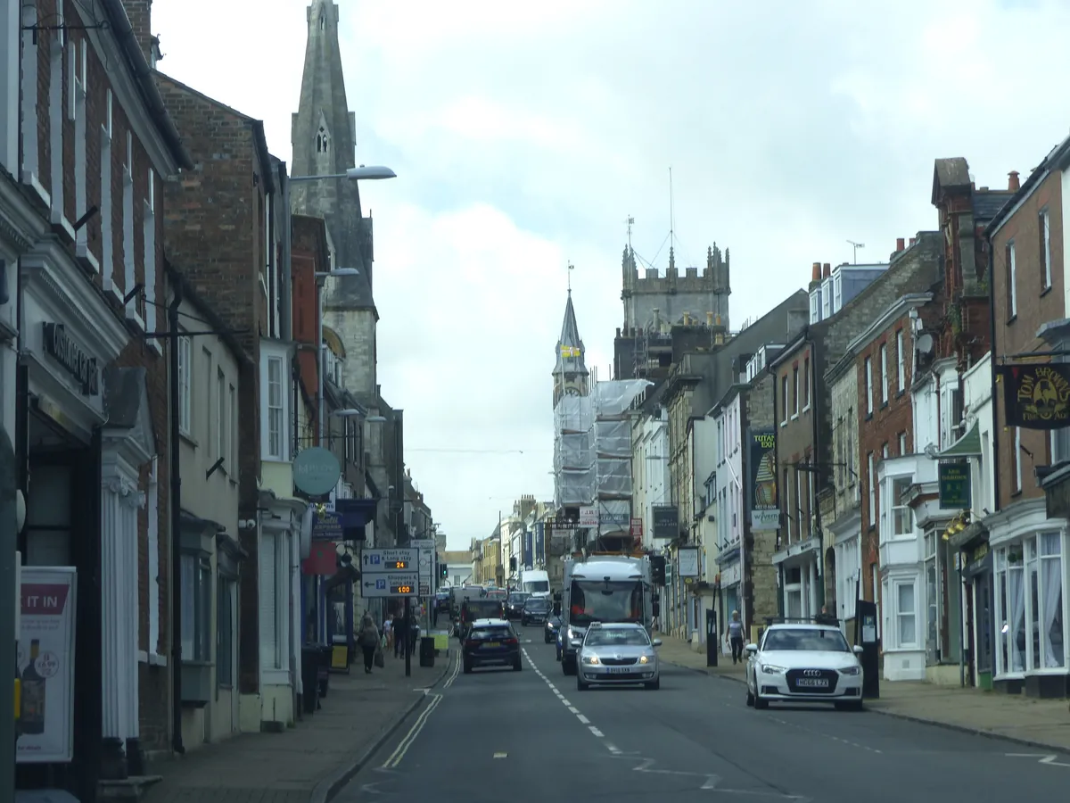 Listed stone and brick buildings with slate roofs in Dorchester town centre on High East Street