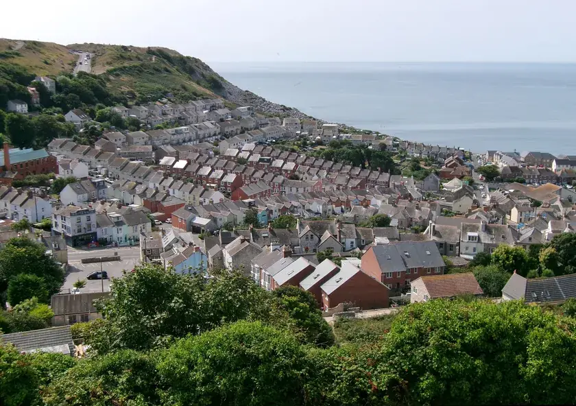 Dense terraced rooftops of Fortuneswell climbing the hillside on the Isle of Portland