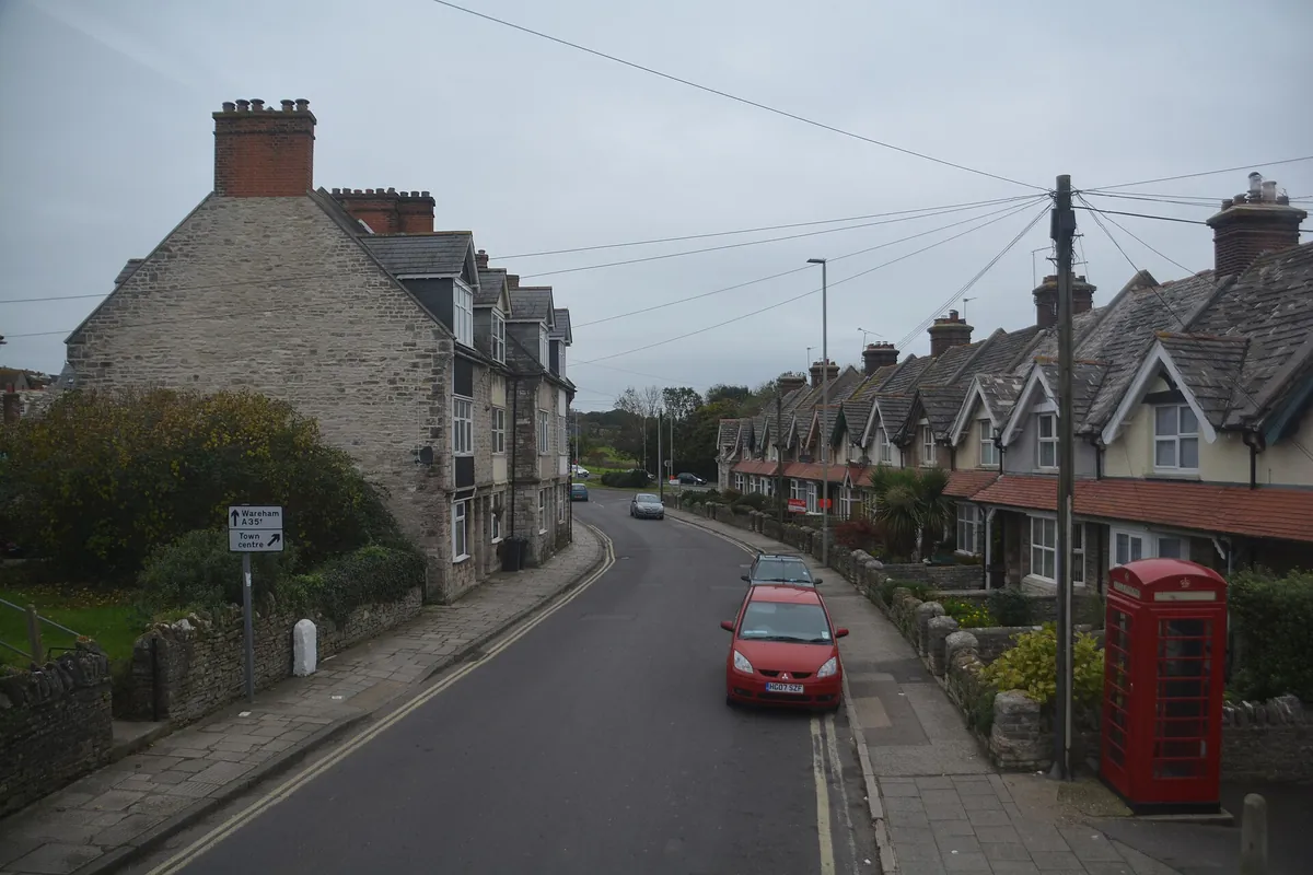 Stone terraced houses with slate roofs on the High Street in Swanage