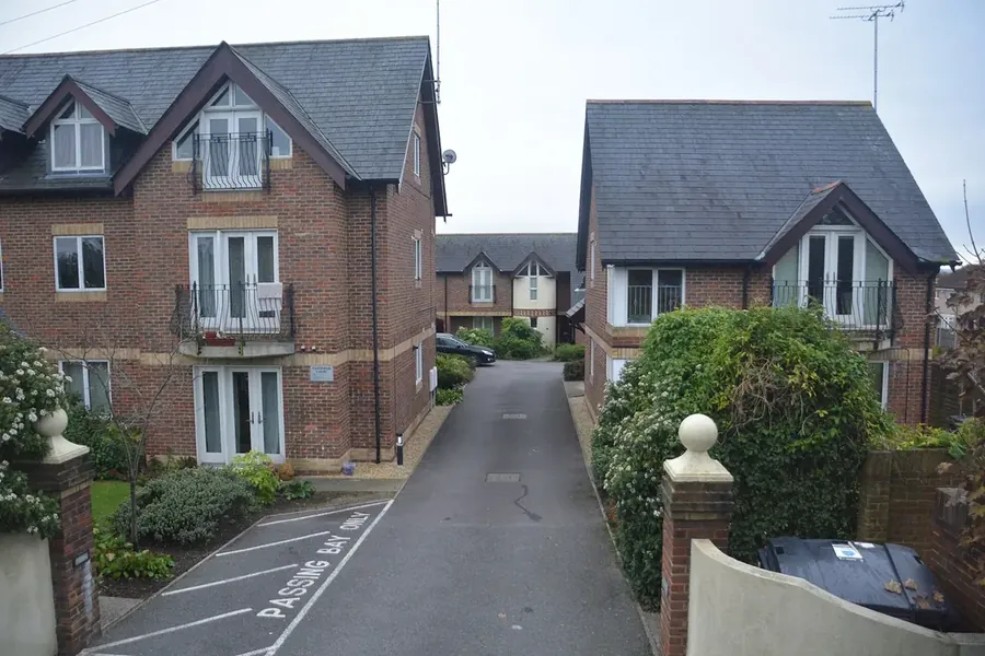 Modern brick houses with slate roofs on Poole Road in Upton, near Poole