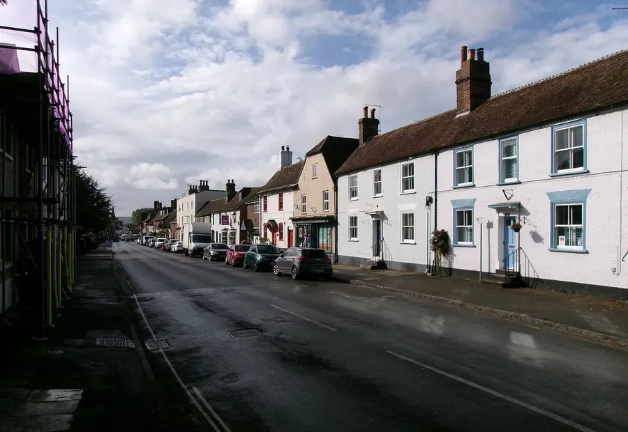 Rendered cottages with clay tile roofs and chimneys along North Street, Wareham