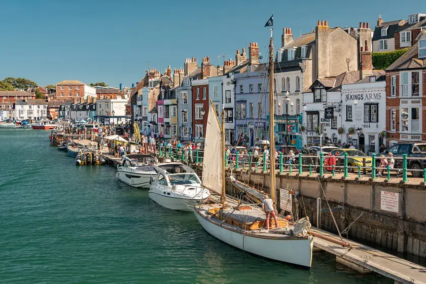 Colourful quayside buildings and rooftops lining Weymouth Harbour